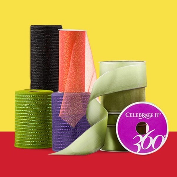 assorted spools of mesh and ribbon on yellow and red background